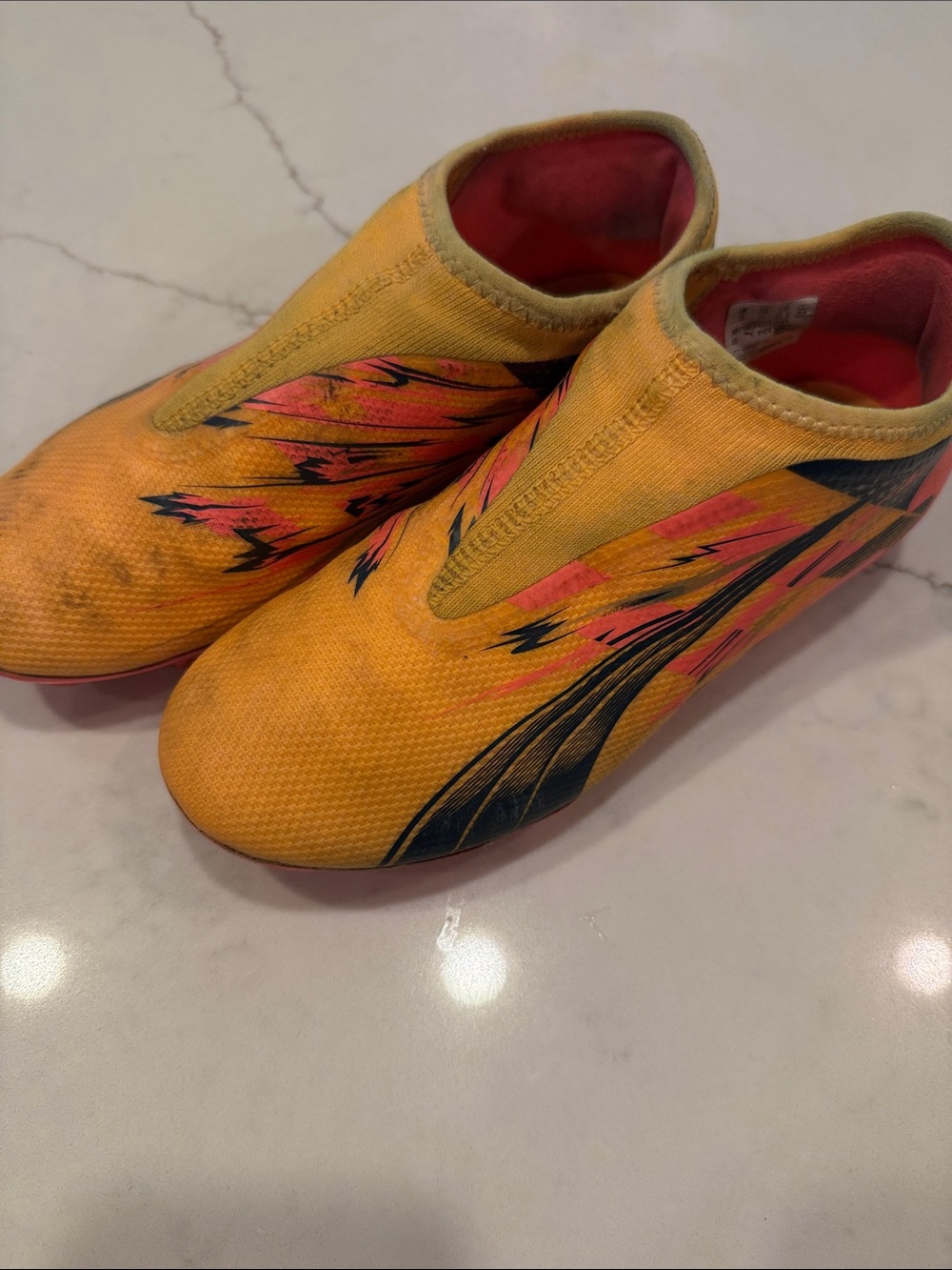 Kids Yellow Slip-On Cleats with Pink Accent